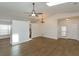 Open concept living room with hardwood floors, high ceilings and skylights at 14424 Quail Trail Ct, Orlando, FL 32837