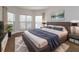 Spacious main bedroom with bay window and plush bedding at 14424 Quail Trail Ct, Orlando, FL 32837