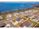 Aerial view of a lovely home with a three-car garage with a water view and beautiful surrounding community at 14436 Topaghan Way, Winter Garden, FL 34787