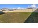 Large grassy backyard with a privacy fence is perfect for outdoor activities at 14436 Topaghan Way, Winter Garden, FL 34787
