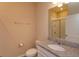 A well-lit bathroom with a granite vanity and shower at 14436 Topaghan Way, Winter Garden, FL 34787