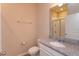 Bathroom with granite countertop vanity, toilet, and walk-in shower at 14436 Topaghan Way, Winter Garden, FL 34787