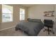Bedroom with large windows, neutral carpet, and ceiling fan at 14436 Topaghan Way, Winter Garden, FL 34787