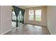 Dining area with sliding glass doors to a patio and large windows, offering lots of natural light at 14436 Topaghan Way, Winter Garden, FL 34787