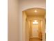 Bright foyer featuring arched doorways, neutral walls, and light wood flooring, creating a warm entry at 14436 Topaghan Way, Winter Garden, FL 34787