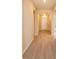 Inviting foyer featuring wood-look tile flooring and an arched entryway, creating a warm welcome at 14436 Topaghan Way, Winter Garden, FL 34787