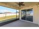 Relaxing screened lanai with ceiling fan and views of the backyard at 14436 Topaghan Way, Winter Garden, FL 34787
