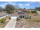 Aerial view showcasing the home's layout, landscaping and neighborhood at 1523 Whooping Dr, Groveland, FL 34736