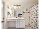 Clean bathroom with white vanity and patterned shower curtain at 1523 Whooping Dr, Groveland, FL 34736