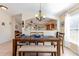 Casual dining room with wood table and view into the kitchen at 1523 Whooping Dr, Groveland, FL 34736