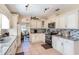 Well-equipped kitchen featuring granite countertops and ample cabinetry at 1523 Whooping Dr, Groveland, FL 34736