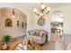 Spacious living room with ornate furniture and arched entryways at 1523 Whooping Dr, Groveland, FL 34736
