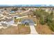 Aerial view of house and surrounding neighborhood at 2011 Begonia Way, Poinciana, FL 34759
