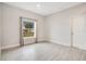 Versatile bedroom with wood-look tile floors and a window at 2011 Begonia Way, Poinciana, FL 34759