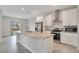 Modern kitchen with granite countertops and white cabinets at 2011 Begonia Way, Poinciana, FL 34759
