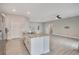 Open concept kitchen and living area with tile flooring at 2011 Begonia Way, Poinciana, FL 34759