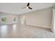 Spacious living room with tile floors and ceiling fan at 2011 Begonia Way, Poinciana, FL 34759