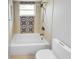 Updated bathroom with tile shower, patterned accent tile, and white fixtures at 203 San Gabriel St, Winter Springs, FL 32708