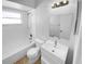 Clean bathroom with white tub, toilet and vanity at 203 San Gabriel St, Winter Springs, FL 32708