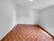 Simple bedroom with terracotta tile floors and a closet at 203 San Gabriel St, Winter Springs, FL 32708