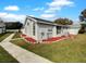 Single story home with landscaped yard and walkway at 203 San Gabriel St, Winter Springs, FL 32708