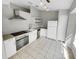 Modern kitchen with white cabinets and stainless steel appliances at 203 San Gabriel St, Winter Springs, FL 32708