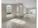 Open concept living area with tile floors and access to patio at 203 San Gabriel St, Winter Springs, FL 32708