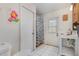 Simple bathroom with updated fixtures and ceramic tile flooring at 2357 Palm Way, Oviedo, FL 32765