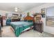 Bright bedroom with a ceiling fan and multiple windows for natural light at 2357 Palm Way, Oviedo, FL 32765