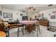Spacious dining area featuring tile floors, stone accent wall, and a ceiling fan at 2357 Palm Way, Oviedo, FL 32765