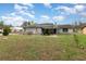Inviting single-story home featuring stone accents, well-maintained lawn, and ample natural light at 2357 Palm Way, Oviedo, FL 32765