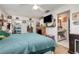 Spacious bedroom with tv, closet and access to the en-suite bathroom at 2357 Palm Way, Oviedo, FL 32765