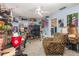 Multi-purpose room with a zebra-striped chair, ample storage, and unique decorative elements; flexible space at 2357 Palm Way, Oviedo, FL 32765