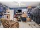 Versatile room with unique decor, shelving, and storage, adaptable for hobbies, workspace, or relaxation at 2357 Palm Way, Oviedo, FL 32765