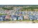 New construction home with a red pin for location nestled in a neighborhood with lush green landscaping at 247 Hampton Loop, Davenport, FL 33837