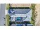 Aerial view of the home showcasing a roof, pool, and well-manicured landscaping at 247 Hampton Loop, Davenport, FL 33837