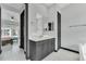 Bathroom featuring a white countertop and gray cabinets, with a view into the main bedroom at 247 Hampton Loop, Davenport, FL 33837