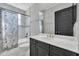 Bathroom featuring white countertop, gray cabinets, and a shower/tub combo with floral curtain at 247 Hampton Loop, Davenport, FL 33837