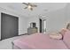 Bright bedroom featuring gray trim, large closet and ceiling fan at 247 Hampton Loop, Davenport, FL 33837