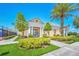 Community clubhouse with manicured landscaping and walkway at 247 Hampton Loop, Davenport, FL 33837