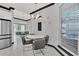 Dining area with stainless steel appliances, pendant lights, and a view of an adjacent formal dining area at 247 Hampton Loop, Davenport, FL 33837