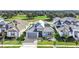 Charming home with a stone facade, two-car garage, and beautifully landscaped front yard at 247 Hampton Loop, Davenport, FL 33837