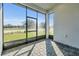 Screened lanai with brick floor offers stunning views of the lush green yard at 247 Hampton Loop, Davenport, FL 33837