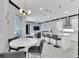 Bright living area with kitchen island, dining area, and view of the adjacent living room at 247 Hampton Loop, Davenport, FL 33837