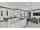 Open concept living space with kitchen, dining area, and access to outdoor pool area at 247 Hampton Loop, Davenport, FL 33837