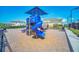 Community playground featuring colorful play structures and a safe, cushioned surface at 247 Hampton Loop, Davenport, FL 33837