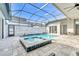Beautiful screened-in pool and spa area with tiled patio, perfect for relaxation and outdoor enjoyment at 247 Hampton Loop, Davenport, FL 33837