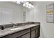 Elegant bathroom with double vanity and granite countertop at 3097 Pequod Pl, Kissimmee, FL 34746