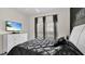 Bedroom with TV, dresser, and large bed at 3097 Pequod Pl, Kissimmee, FL 34746