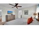 Spacious bedroom with dresser, TV, and ensuite bathroom access at 3097 Pequod Pl, Kissimmee, FL 34746